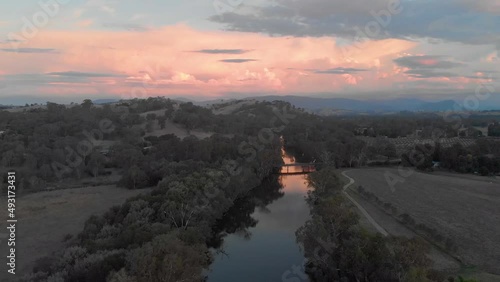 Aerial shot orbiting around the goulburn river with a beautiful sunrise looking out to the cathedral ranges. photo
