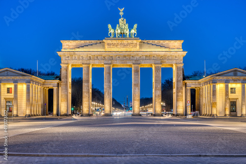 The famous illuminated Brandenburg Gate in Berlin at dawn photo