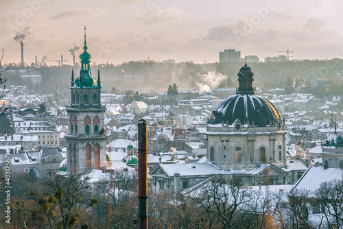 Lviv, Ukraine - February, 2022: City view from the Vysoky Zamok (Lviv castle hill), KORNIAKTA TOWER, the dome of Dominican church. photo