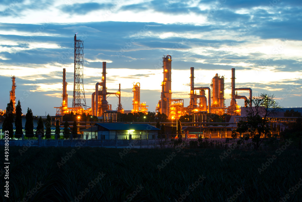 Oil refinery industry at sunset - factory - petrochemical plant Oil refinery industry at sunset - factory - petrochemical plant