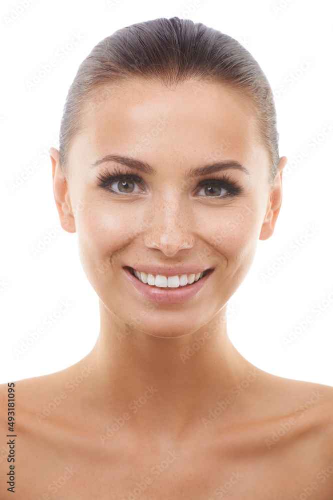 Obraz premium Radiant and happy. Beautiful young woman smiling while isolated against a white background.