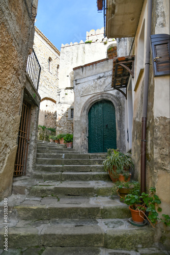 A narrow street among the old stone houses of Castellabate  town in Salerno province  Italy.  