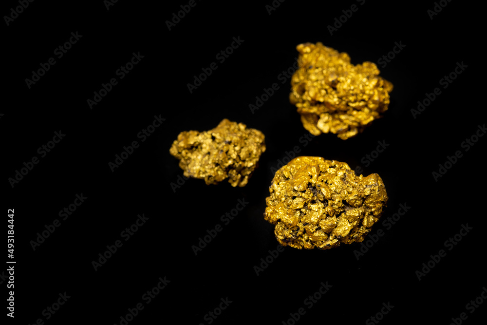 The pure gold ore found in the mine on black background