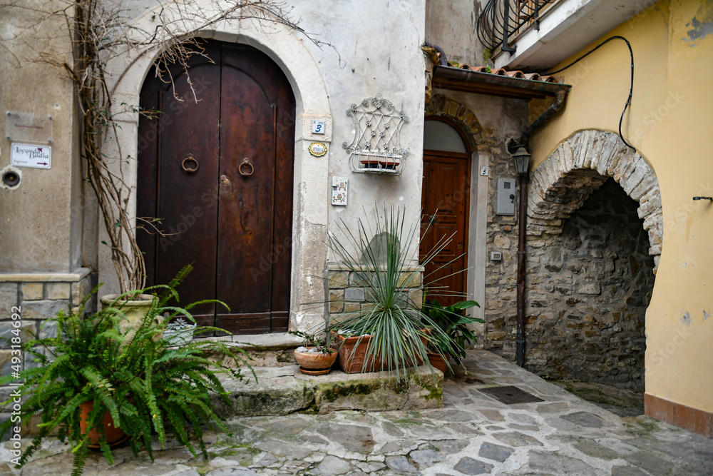 A narrow street among the old stone houses of Castellabate, town in Salerno province, Italy.