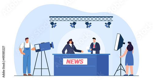 News presenters behind desk in studio with camera crew. Backstage or set of broadcast or TV show flat vector illustration. Television, broadcasting concept for banner, website design or landing page