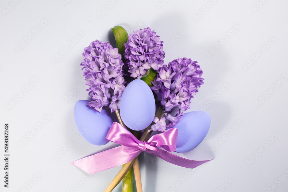 Easter card on a grey background with flowers.