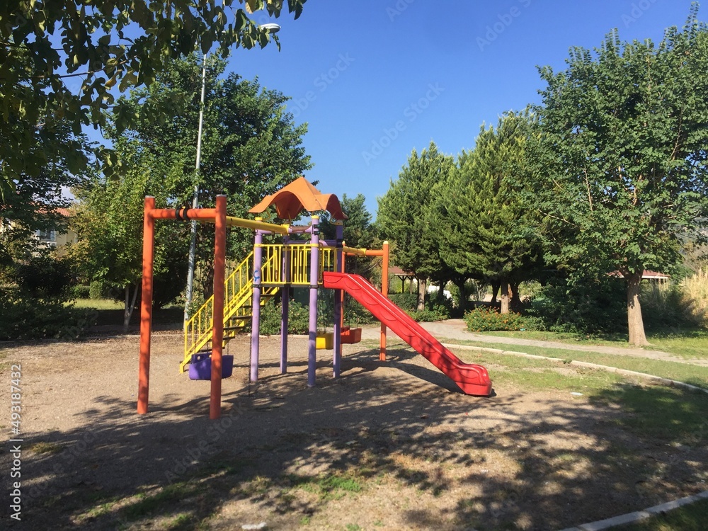 Fototapeta premium empty playground with green or blue background. selective focus landscape. outdoor parks without children.