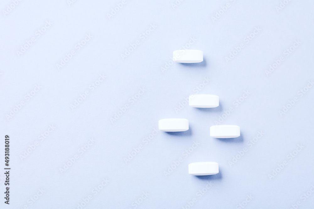 Lysine tablets. Concept for a healthy dietary supplementation. Nervous System Support. Soft focus. Bright background. Close up. Copy space.