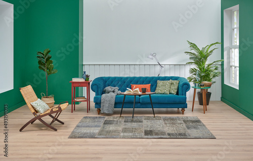 Blue sofa pillow and blanket decoration  green and white concept  lamp plant coffee table style  carpet  chair and home design  interior concept.