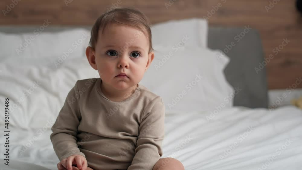 Video of caucasian little babysitting in the bed. Shot with RED helium camera in 8K. Video of caucasian little babysitting in the bed. Shot with RED helium camera in 8K.