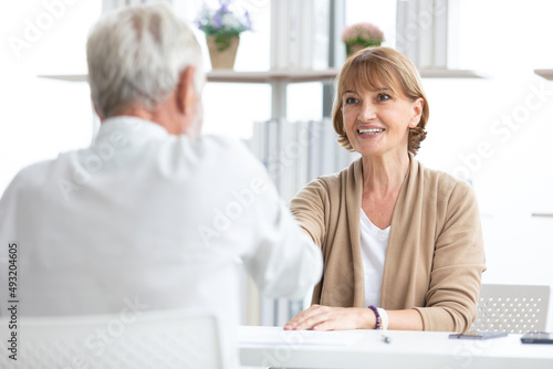 senior businesswoman shaking hands and congratulations for a new job