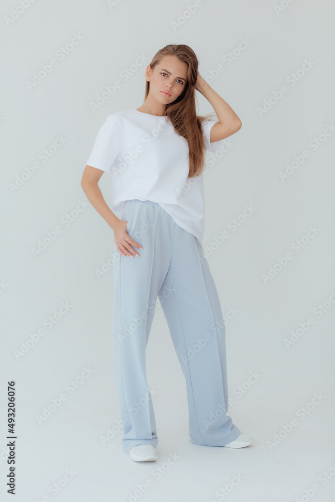 Ukrainian young woman in sweatshirt mock up on light background. Female body and style concept. Advertisement or clothes sale design. Mock up for design, clothes shop sale. Close up emotional woman Ukrainian young woman in sweatshirt mock up on light background. Female body and style concept. Advertisement or clothes sale design. Mock up for design, clothes shop sale. Close up emotional woman