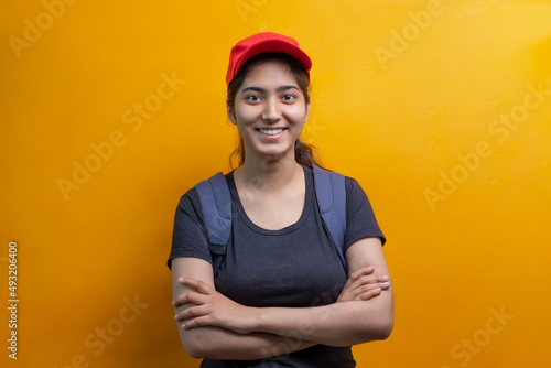PORTRAIT OF A Delivery Woman STANDING WITH BAG LOOKING HAPPILY AT CAMERA © paltu