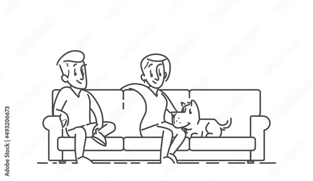 Couple sitting oh the sofa with their dog Couple sitting oh the sofa with their dog