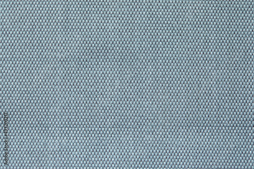 Knitted texture. Texture of jacquard fabric with gray blue geometric pattern. Crochet mosaic pattern.