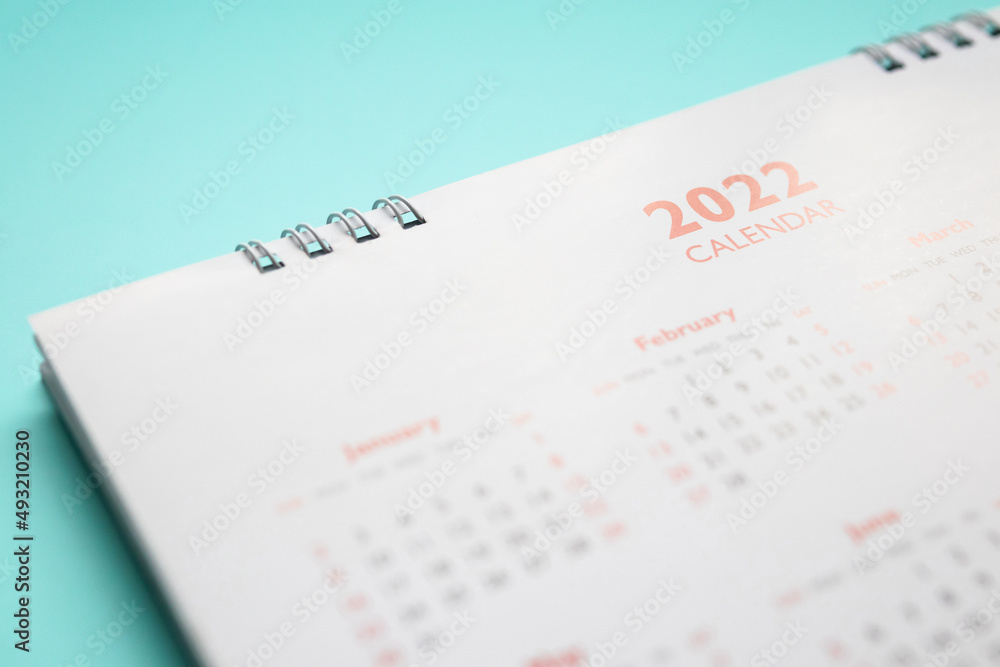 2022 calendar page on blue background business planning appointment meeting concept 2022 calendar page on blue background business planning appointment meeting concept