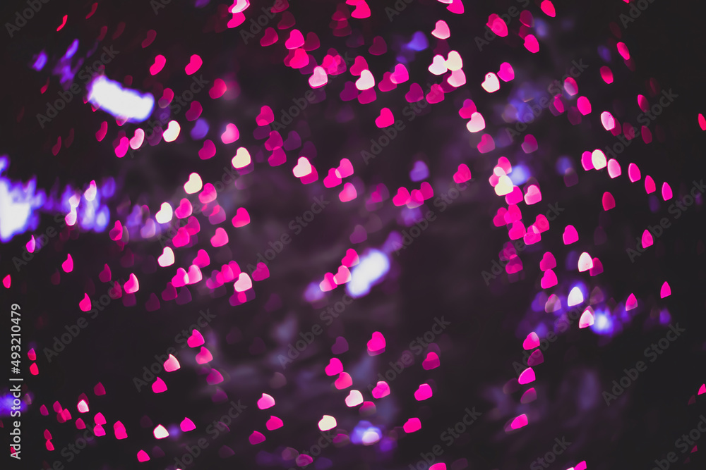 Blurred backgrounds with tiny pink hearts bokeh. Blur shiny led lights for for Valentines day