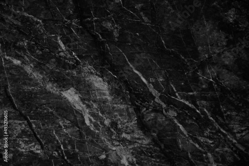Black white rock surface texture. Close-up. Marble effect. Dark gray stone background for design.