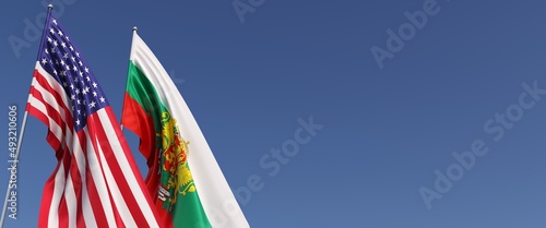 Flags of USA and Bulgaria on flagpoles on the side. Flags on a blue background. Place for text. United States of America. Bulgarian, Sofia. Commonwealth. 3D illustration.