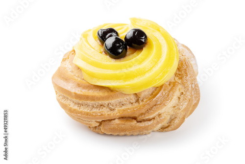 Italian dessert, Zeppola di San Giuseppe, baked cake garnished with custard and sour cherries in syrup, isolated on white background, close-up. photo