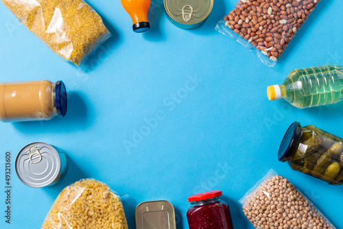 Valokuva eating, charity and donation concept - close up of different packed food on blue