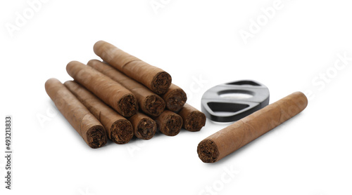 Cigars and guillotine cutter on white background