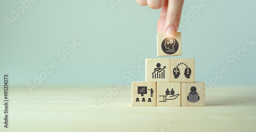 Human resource training and development concept.Business, personal development improving and enhancing competency, performance..Putting wooden cubes training with brainstorm, coaching, learning icons.