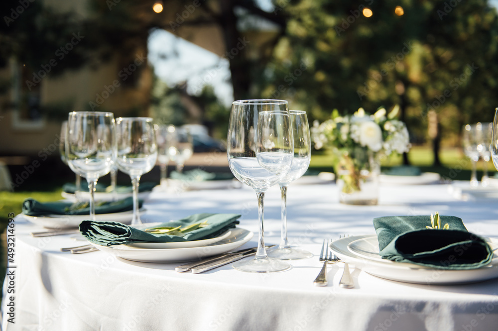 Preparing for an open-air party. Decorated served tables await guests. Decoration Details Preparing for an open-air party. Decorated served tables await guests. Decoration Details