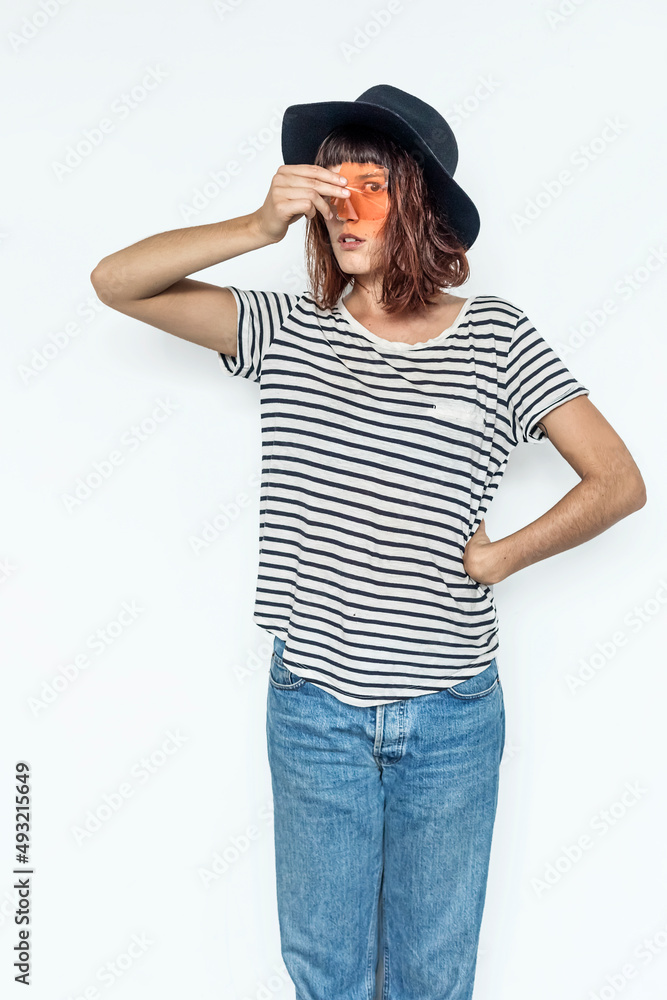 Young woman portrait covering her eye with a photography filter Young woman portrait covering her eye with a photography filter