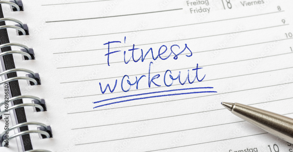 Fitness workout written on a calendar page Fitness workout written on a calendar page