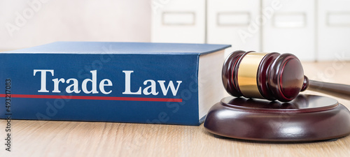 A law book with a gavel  - Trade law