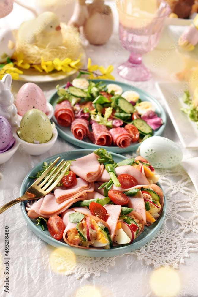 Easter breakfast with fresh salads and ham cones filled with eggs and vegetables
