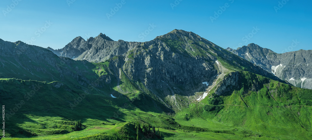 Kleinwalsertal alps mountains landscape panorama background - Mountain panorama in summer with blue sky in Austria