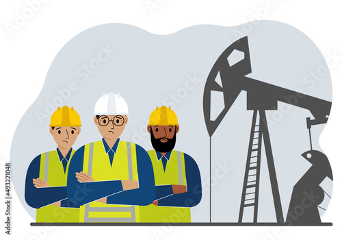 Oil refinery engineer. A male worker in front of a pumping unit for oil extraction, oil drilling and well repair.