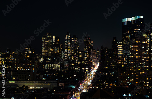 A shot of Manhattan New York citiscape skyline at night. The shot was taken on 42nd St looking into the skyscrapers lit up with their internal lights