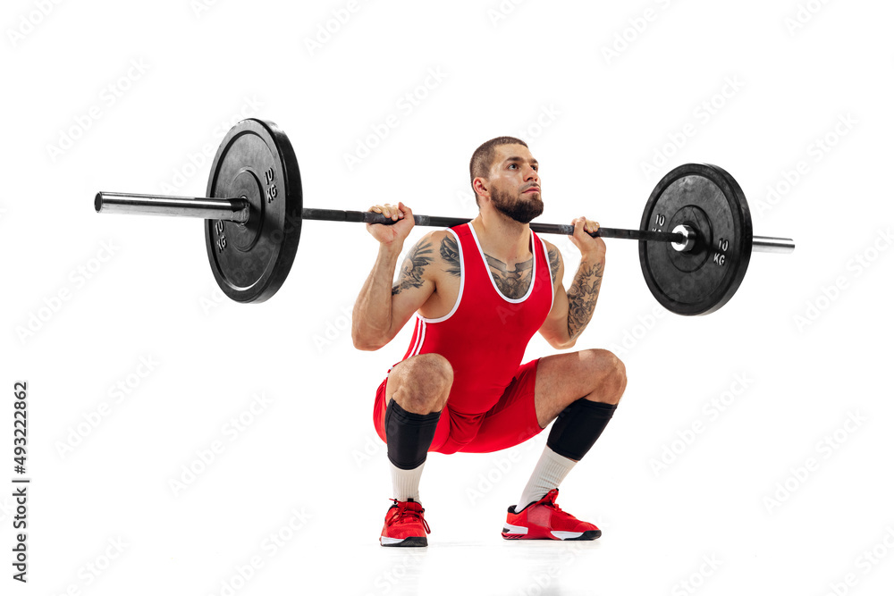Close-up strong man red sportswear raising barbell up isolated on white background. Sport, weightlifting, power, achievements concept Close-up strong man red sportswear raising barbell up isolated on white background. Sport, weightlifting, power, achievements concept