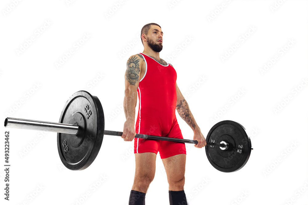 Close-up strong man red sportswear raising barbell up isolated on white background. Sport, weightlifting, power, achievements concept Close-up strong man red sportswear raising barbell up isolated on white background. Sport, weightlifting, power, achievements concept