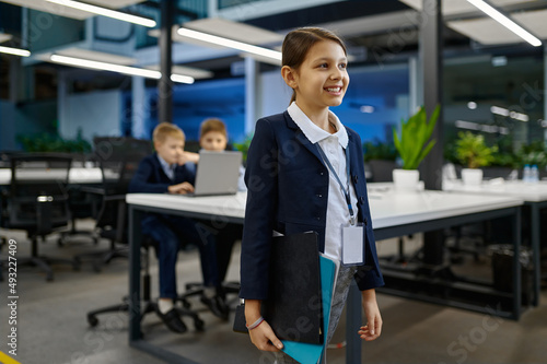 Wallpaper Mural Portrait of smart little smiling business girl Torontodigital.ca