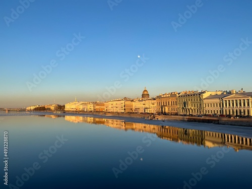 City river, blue sky, reflection on the water  © Oksana