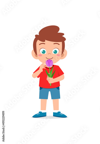 little boy holding flower and sniff the scent