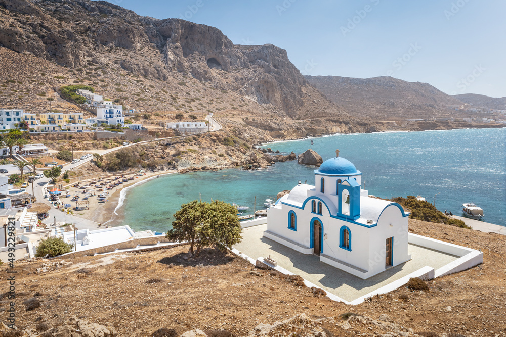 View over greek fishing village with beach, Finiki, Greek Islands