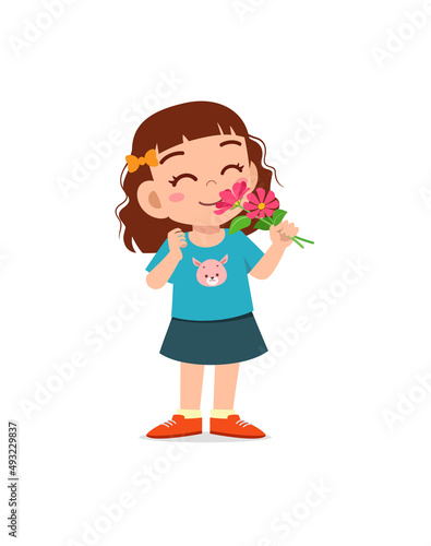 little girl holding flower and sniff the scent