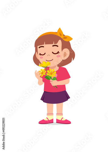 little girl holding flower and sniff the scent
