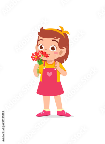 little girl holding flower and sniff the scent