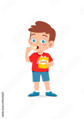 little boy eat potato chips and feel happy