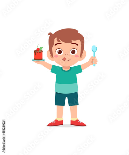 little boy eat sweet cake and feel happy