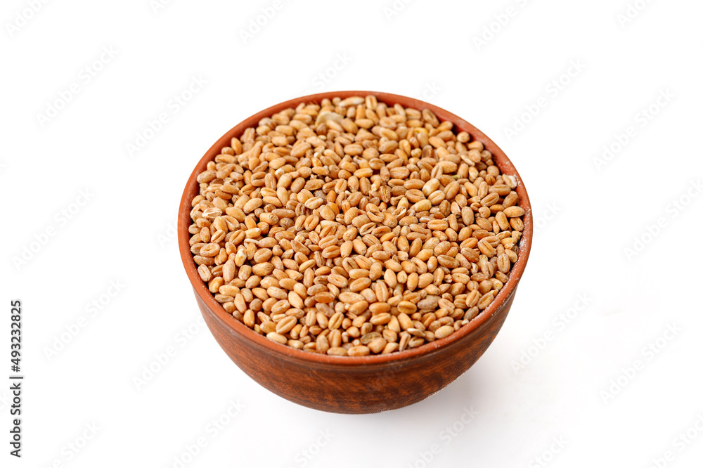 Pearl barley groats in bowls and bags isolated on a white background. High quality photo Pearl barley groats in bowls and bags isolated on a white background. High quality photo
