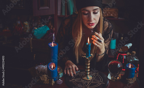 Shaman woman doing ritual magic for helping. Concept of pagan or wicca magic. Old and new world