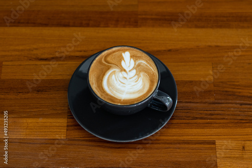 hot latte art coffee on wood table  relax time