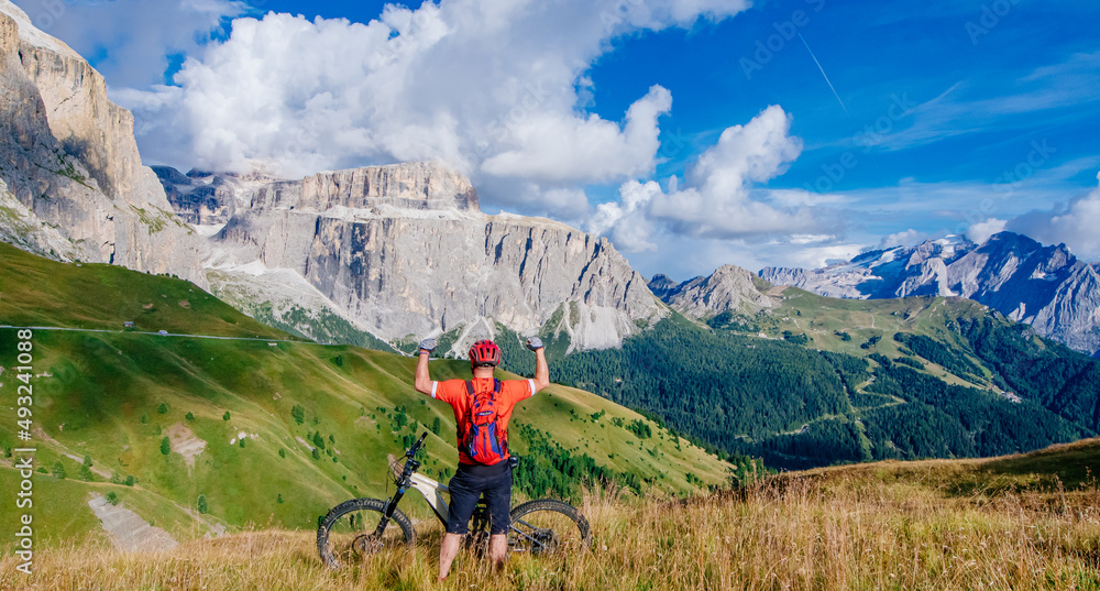 Fototapeta premium Dolomites by mountain bike, beautiful space, views and bicycle paths, Adventure and journey that gives joy and happiness